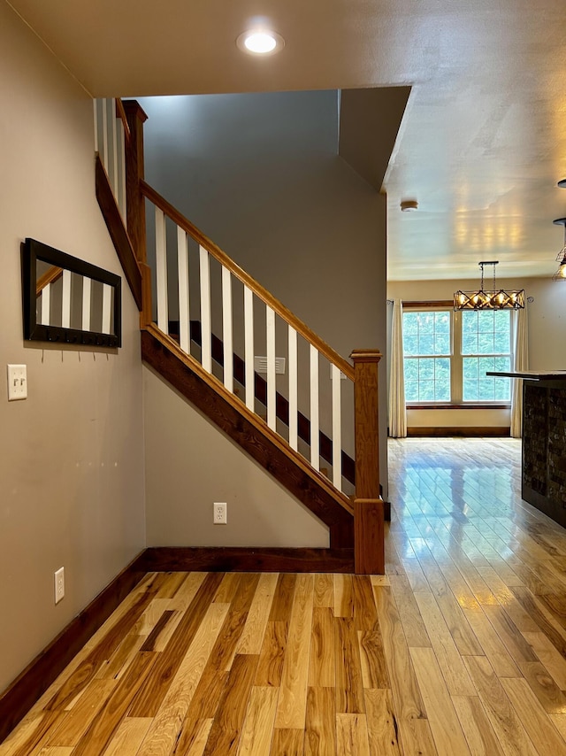 1756 Paxton Rd, Morning View, KY 41063 - stairway featuring a chandelier, wood finished floors, and recessed lighting