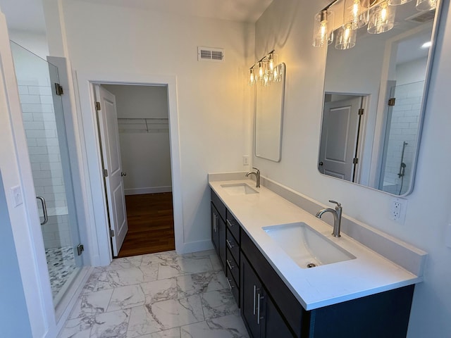 10448 Pleaasant Ridge Rd, Alexandria, KY 41001 - full bath with marble look tile flooring, double vanity, a shower stall, a chandelier, and a spacious closet