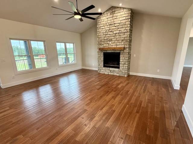10448 Pleaasant Ridge Rd, Alexandria, KY 41001 - unfurnished living room with ceiling fan, dark wood-style floors, a stone fireplace, and high vaulted ceiling