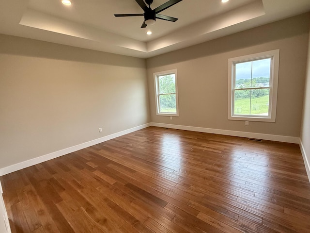 10448 Pleaasant Ridge Rd, Alexandria, KY 41001 - empty room with a tray ceiling, dark wood finished floors, ceiling fan, and recessed lighting
