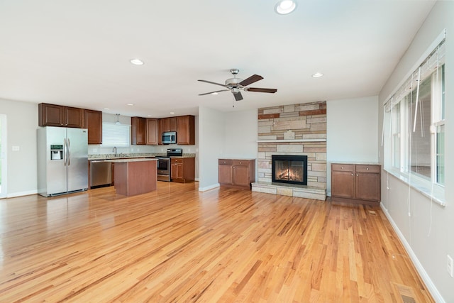 9513 Old Union Rd, Union, KY 41091 - unfurnished living room featuring light wood-style floors, ceiling fan, recessed lighting, and a fireplace