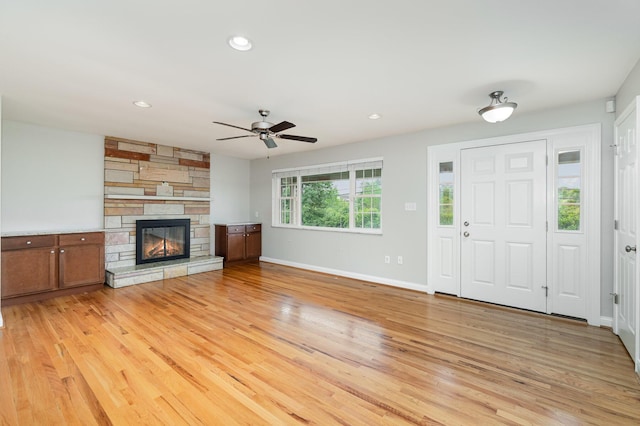 9513 Old Union Rd, Union, KY 41091 - unfurnished living room with ceiling fan, light wood finished floors, a stone fireplace, and recessed lighting
