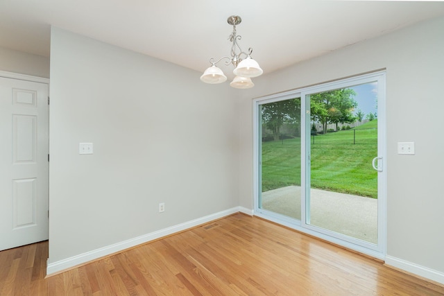 9513 Old Union Rd, Union, KY 41091 - empty room with light wood finished floors and a chandelier
