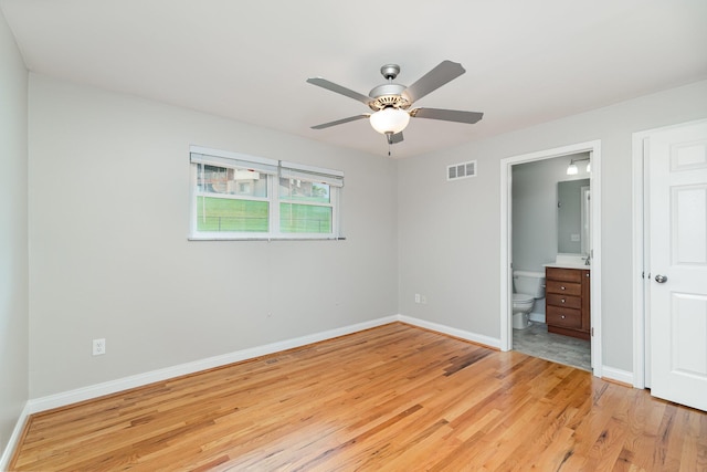 9513 Old Union Rd, Union, KY 41091 - unfurnished bedroom featuring light wood-type flooring, ensuite bath, and a ceiling fan