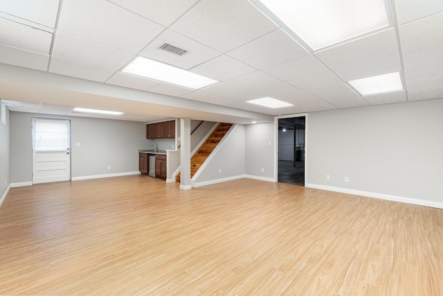 9513 Old Union Rd, Union, KY 41091 - unfurnished living room with light wood-style floors, stairs, and a drop ceiling