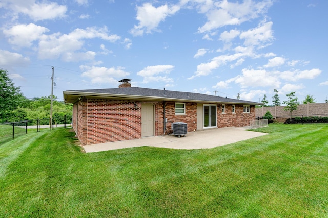9513 Old Union Rd, Union, KY 41091 - back of house with a patio area, a fenced backyard, brick siding, and a chimney