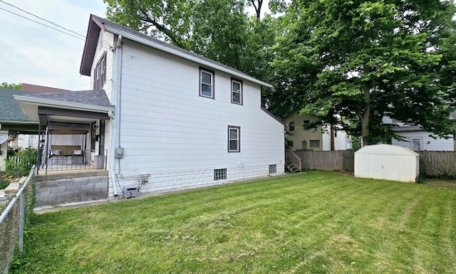 4336 Glenn Ave, Covington, KY 41015 - rear view of house featuring a shed, a shingled roof, and stairway