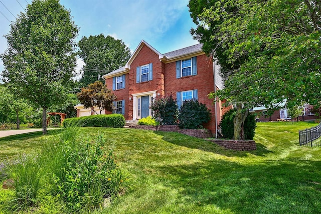 1906 Robins Run, Hebron, KY 41048 - colonial inspired home with brick siding, a garage, and a front lawn
