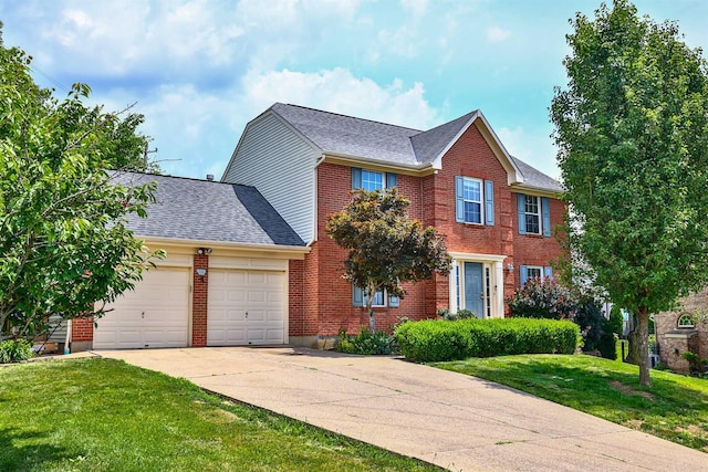 1906 Robins Run, Hebron, KY 41048 - colonial inspired home featuring a garage, a front yard, driveway, brick siding, and a shingled roof