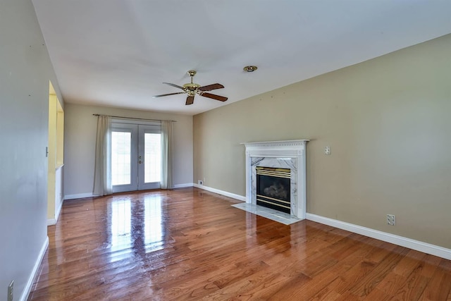 1906 Robins Run, Hebron, KY 41048 - unfurnished living room with wood finished floors, ceiling fan, french doors, and a fireplace