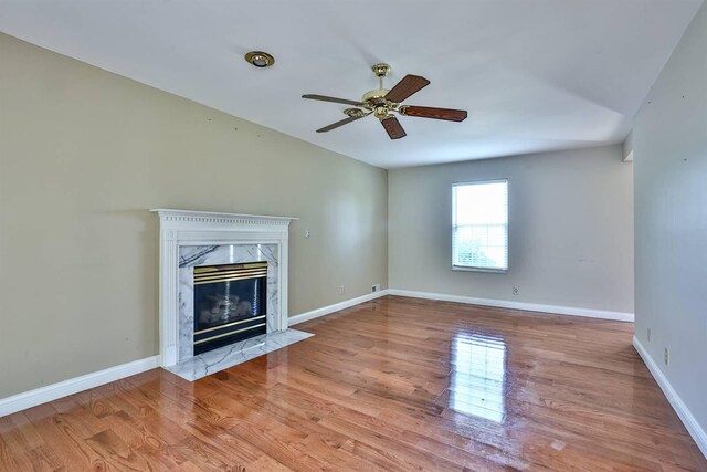 1906 Robins Run, Hebron, KY 41048 - unfurnished living room with a fireplace, wood finished floors, and a ceiling fan