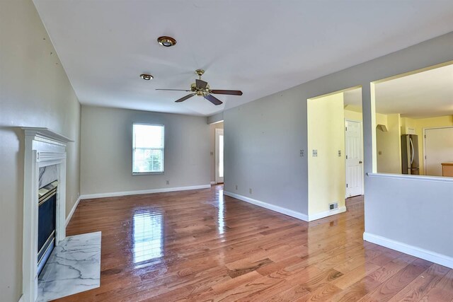 1906 Robins Run, Hebron, KY 41048 - unfurnished living room with ceiling fan, light wood-style floors, and a fireplace
