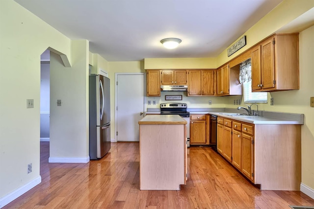 1906 Robins Run, Hebron, KY 41048 - kitchen with stainless steel appliances, light wood-type flooring, light countertops, and a center island