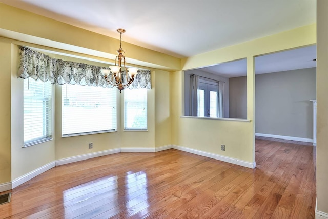 1906 Robins Run, Hebron, KY 41048 - empty room with a chandelier and wood-type flooring