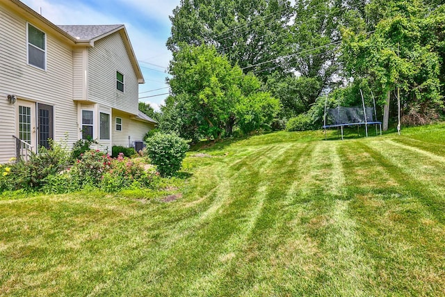 1906 Robins Run, Hebron, KY 41048 - view of green lawn featuring a trampoline and french doors