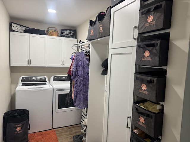 2706 Decoursey Ave, Covington, KY 41015 - laundry area with separate washer and dryer, cabinet space, and wood finished floors