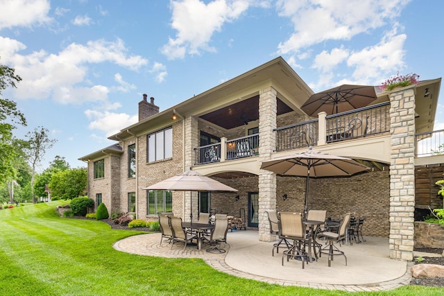 1007 Campo Ct, Union, KY 41091 - back of property with a balcony, a patio area, a lawn, and a chimney