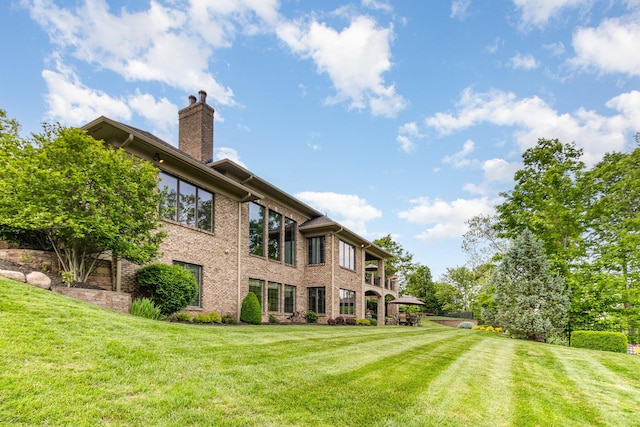 1007 Campo Ct, Union, KY 41091 - rear view of property featuring a chimney, a lawn, and brick siding