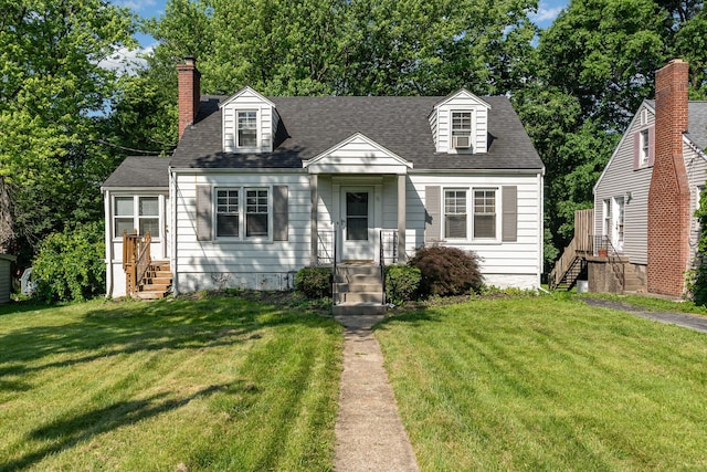 65 Beech Dr, Edgewood, KY 41017 - cape cod home featuring entry steps, a front lawn, a chimney, and a shingled roof