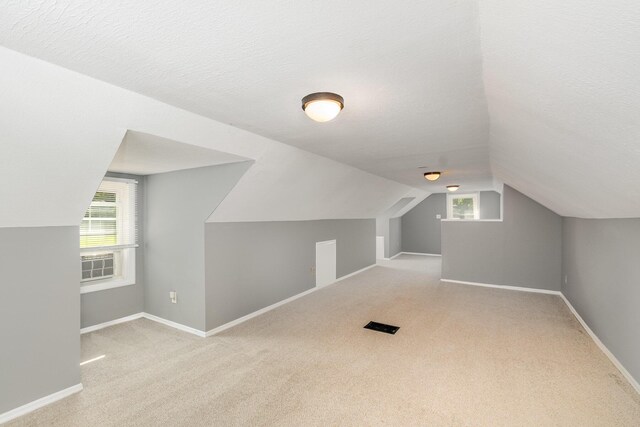 65 Beech Dr, Edgewood, KY 41017 - bonus room featuring carpet floors, vaulted ceiling, a textured ceiling, and cooling unit