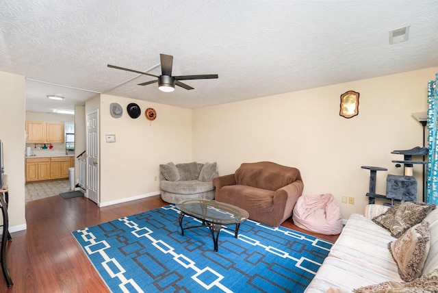 1845 Conrad Ln, Burlington, KY 41005 - living room featuring dark wood-type flooring, a ceiling fan, and a textured ceiling