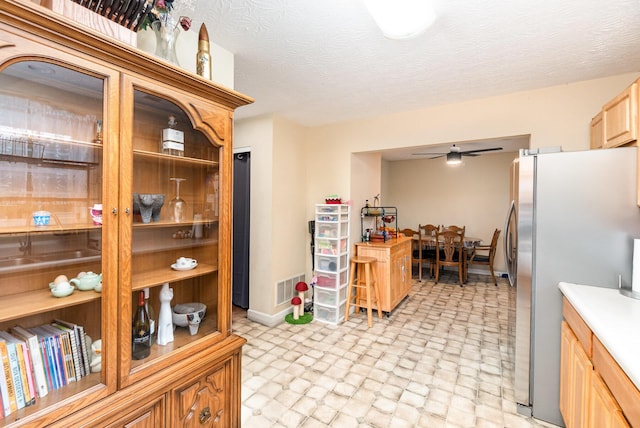 1845 Conrad Ln, Burlington, KY 41005 - kitchen featuring freestanding refrigerator, ceiling fan, light countertops, light brown cabinets, and light floors