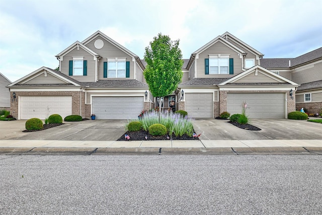 852 Flint Rdg Unit 4-302, Cold Spring, KY 41076 - view of front of house with brick siding, concrete driveway, and an attached garage