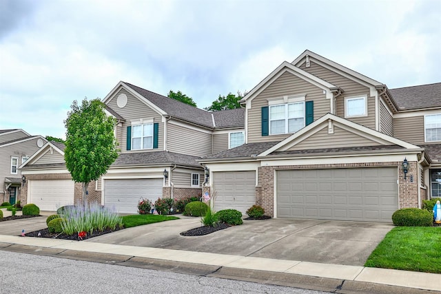 852 Flint Rdg Unit 4-302, Cold Spring, KY 41076 - view of front of home with brick siding, driveway, and an attached garage