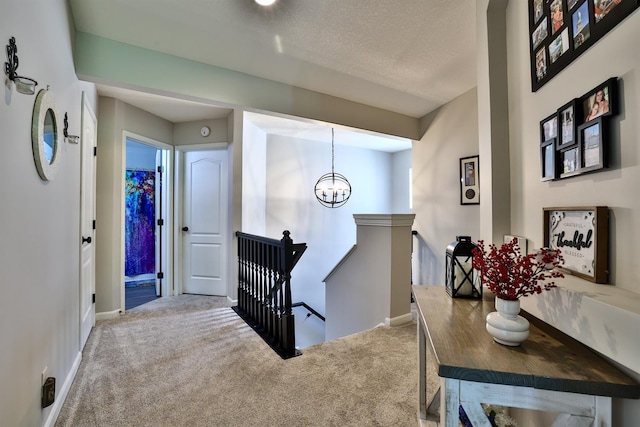 852 Flint Rdg Unit 4-302, Cold Spring, KY 41076 - carpeted foyer featuring a chandelier and a textured ceiling