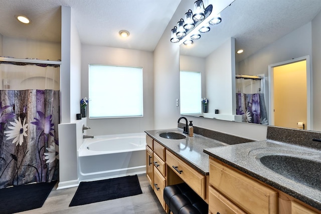852 Flint Rdg Unit 4-302, Cold Spring, KY 41076 - bathroom featuring a stall shower, healthy amount of natural light, double vanity, wood finished floors, and recessed lighting