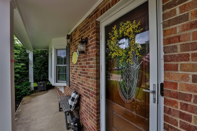 328 Creekwood Dr, Edgewood, KY 41017 - view of exterior entry with brick siding and a porch