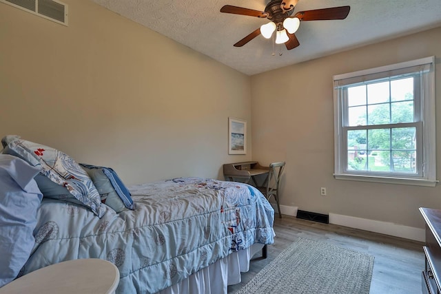328 Creekwood Dr, Edgewood, KY 41017 - bedroom with wood finished floors, a textured ceiling, and ceiling fan