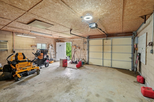 1720 Pettit Pike, Glencoe, KY 41046 - garage with concrete block wall, a garage door opener, and a wall mounted AC
