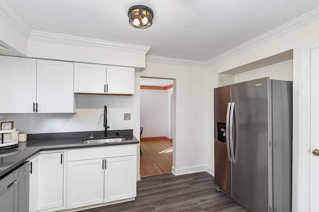 7 Ross Ave, Fort Mitchell, KY 41017 - kitchen with stainless steel fridge with ice dispenser, dark countertops, dark wood-style floors, white cabinets, and crown molding