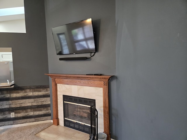 10 Meadow Ln Unit 9, Highland Heights, KY 41076 - detailed view of a tile fireplace and freestanding refrigerator
