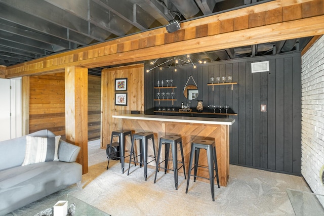 1006 Nob Hill Dr, Fort Thomas, KY 41075 - indoor dry bar with wood walls and carpet flooring