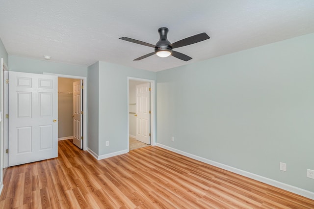 10602 Christa Ct Unit 6, Alexandria, KY 41001 - unfurnished bedroom featuring light wood-style floors, a spacious closet, a closet, and ceiling fan