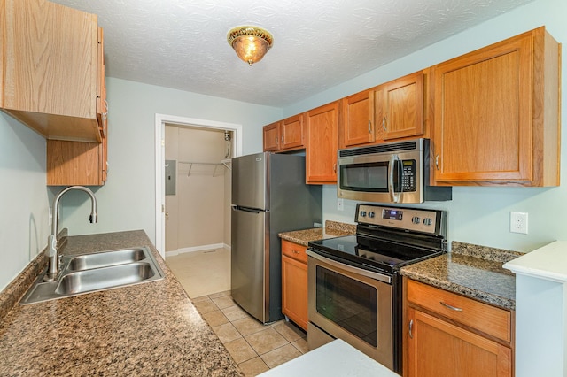 10602 Christa Ct Unit 6, Alexandria, KY 41001 - kitchen with stainless steel appliances, brown cabinets, light tile patterned floors, and electric panel