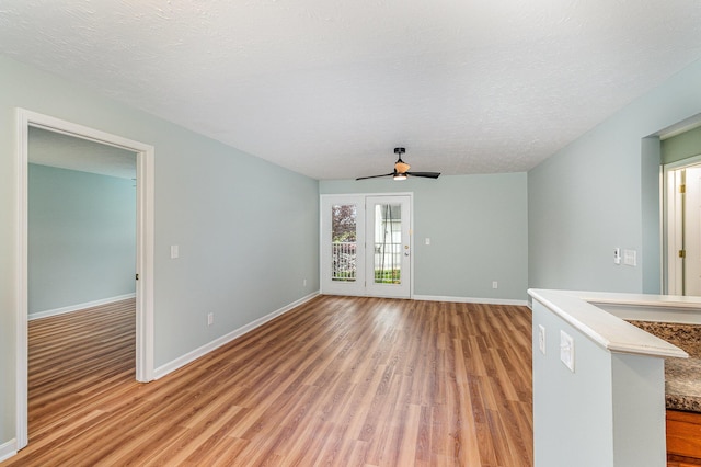 10602 Christa Ct Unit 6, Alexandria, KY 41001 - empty room featuring light wood-style floors, ceiling fan, and a textured ceiling
