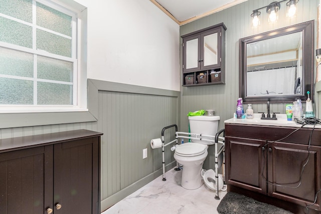 9294 Marshall Rd, Covington, KY 41015 - bathroom with marble look tiles, vanity, ornamental molding, and wood walls