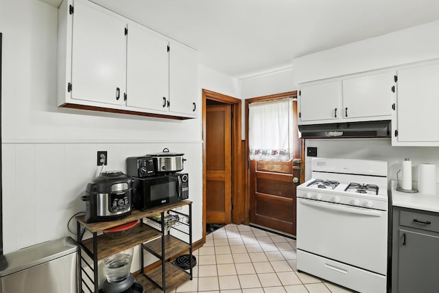 50 Russell St, Florence, KY 41042 - kitchen featuring white gas range oven, under cabinet range hood, white cabinetry, and black microwave