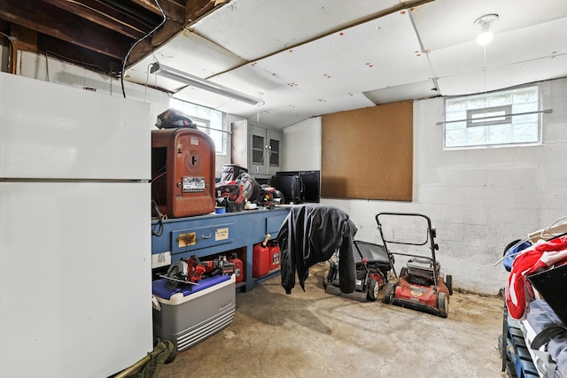 50 Russell St, Florence, KY 41042 - basement featuring freestanding refrigerator, plenty of natural light, and concrete block wall