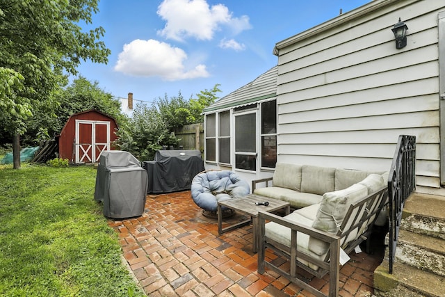 50 Russell St, Florence, KY 41042 - view of patio featuring an outdoor hangout area, area for grilling, a storage shed, and a sunroom