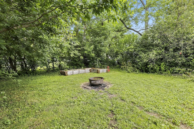 50 Russell St, Florence, KY 41042 - view of green lawn with an outdoor fire pit