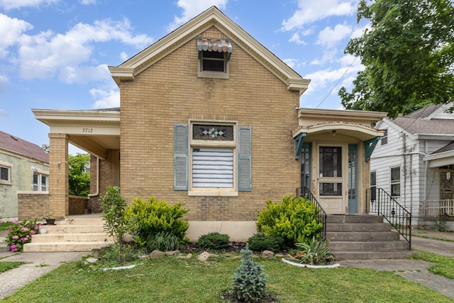 3712 Park Ave, Covington, KY 41015 - view of front of property featuring brick siding and a front yard