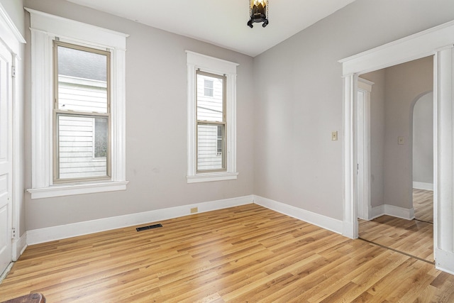3712 Park Ave, Covington, KY 41015 - empty room featuring light wood-style floors and arched walkways