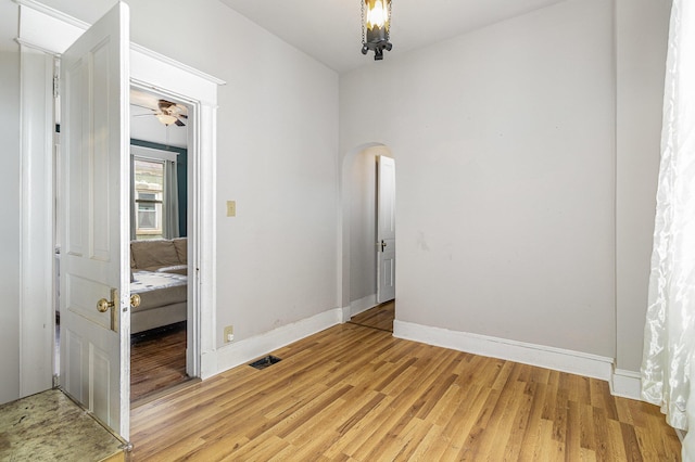3712 Park Ave, Covington, KY 41015 - spare room featuring light wood-style floors and arched walkways