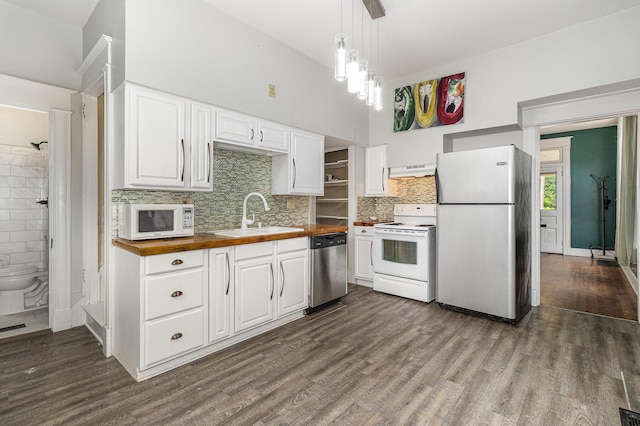 3712 Park Ave, Covington, KY 41015 - kitchen with white appliances, butcher block countertops, under cabinet range hood, dark wood-style floors, and white cabinets