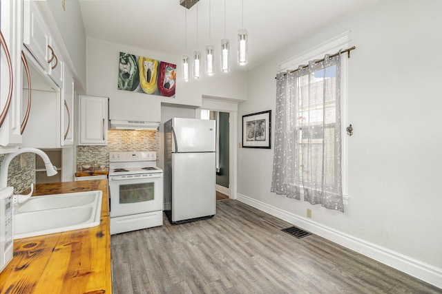 3712 Park Ave, Covington, KY 41015 - kitchen with white appliances, premium range hood, wood counters, light wood finished floors, and white cabinets