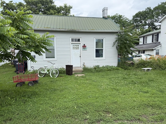 3057 Front St, Petersburg, KY 41080 - back of property featuring a yard, a metal roof, and a chimney